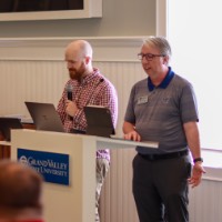 Josh and Greg presenting to audience and award winners